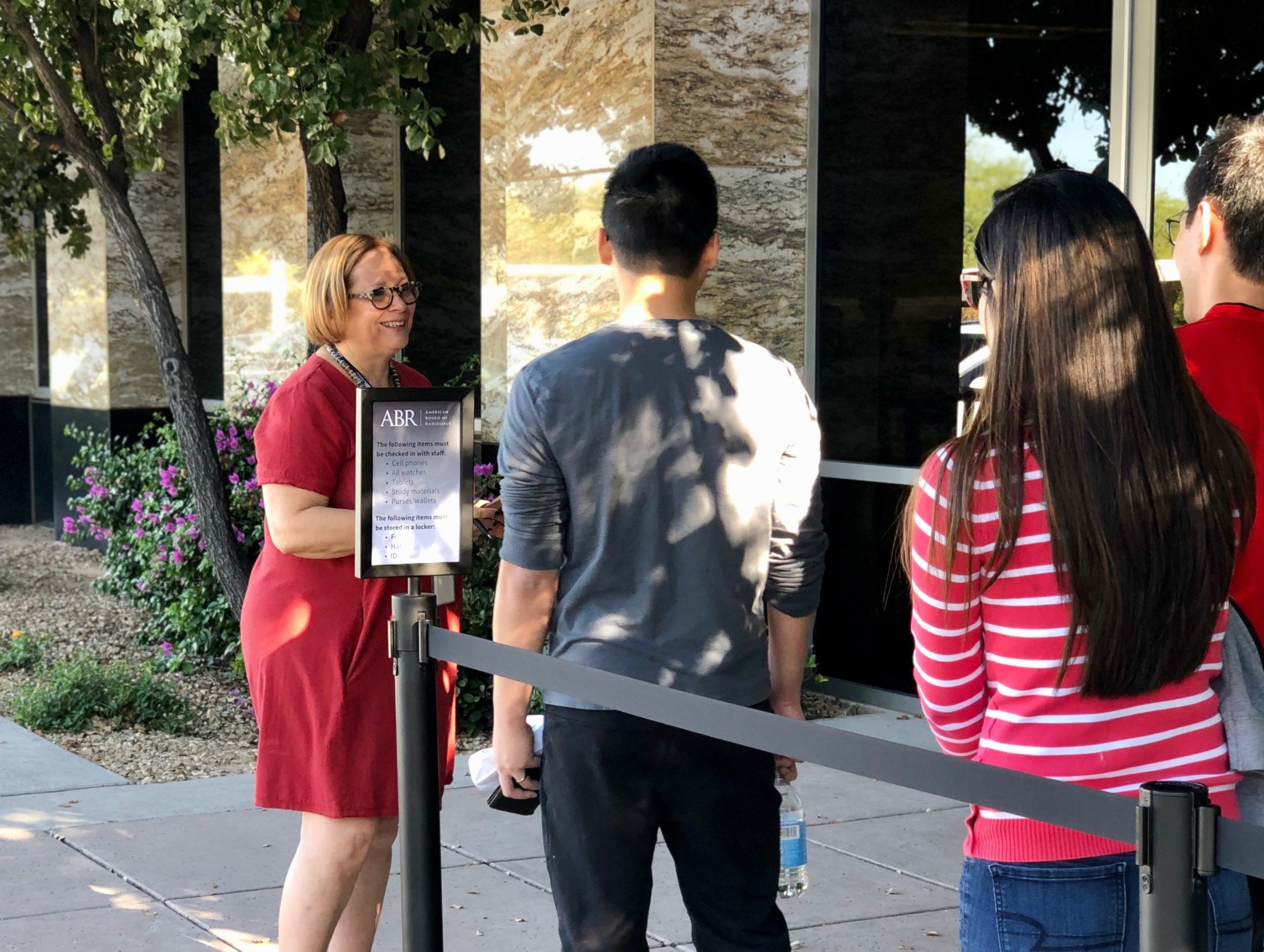 Executive Director Valerie Jackson, MD, talks with candidates outside the ABR Exam Center