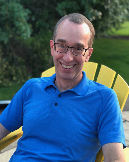 Dr. Wood sitting outside.