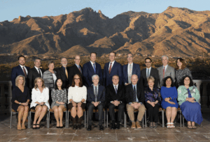 The ABR Trustees and Governors pose seated in front of a backdrop of the Santa Catalina Mountains in Tucson, Arizona.